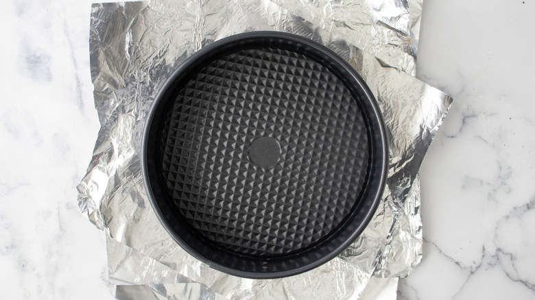 springform pan with aluminum foil