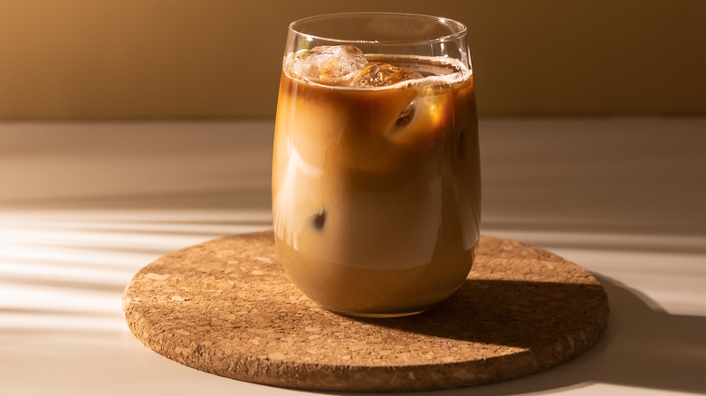 An iced coffee on a coaster