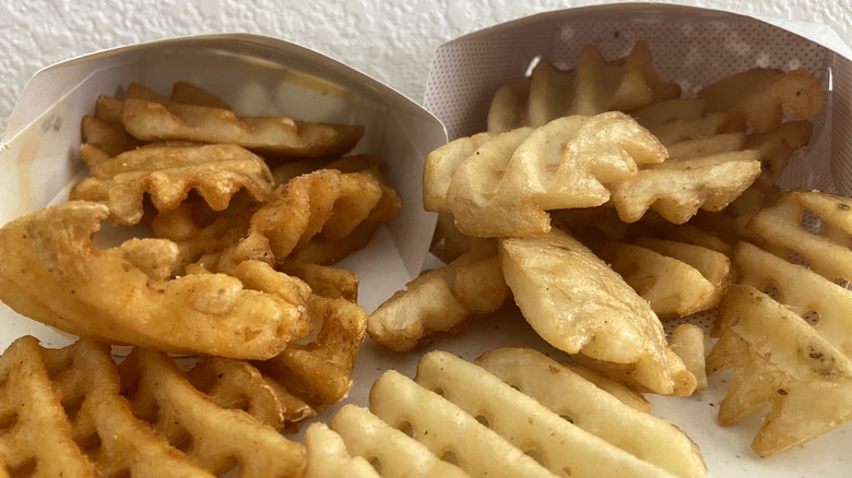 waffle fries spilling into plate