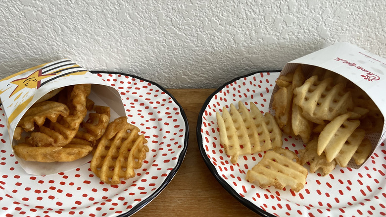 fries spilling onto separate plates