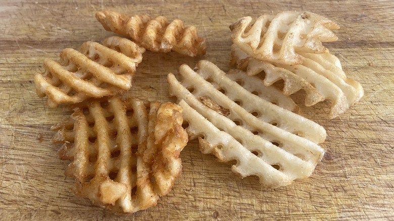 loose fries on cutting board