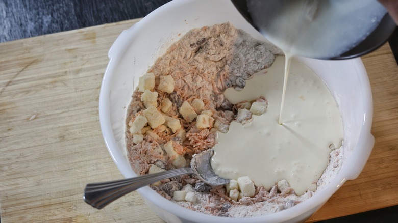 pouring cream into mixing bowl