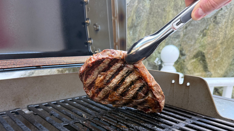 steak cooking on a grill