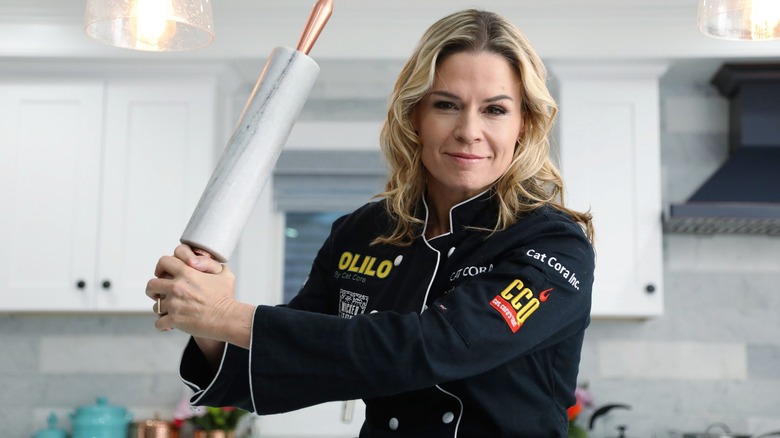 Chef Cat Cora holds rolling pin