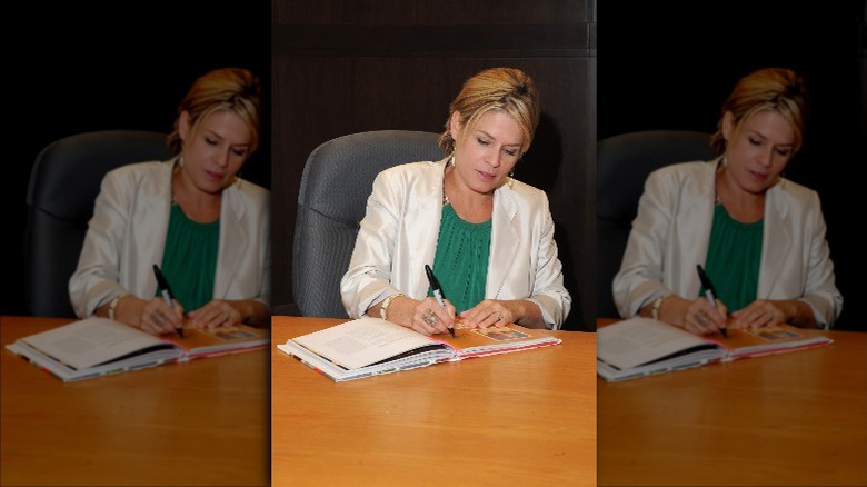 Cat Cora signing her cookbook