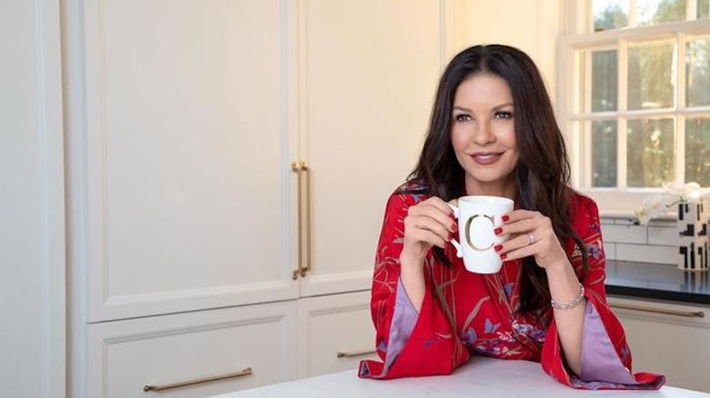 Catherine-Zeta Jones drinking from a coffee mug