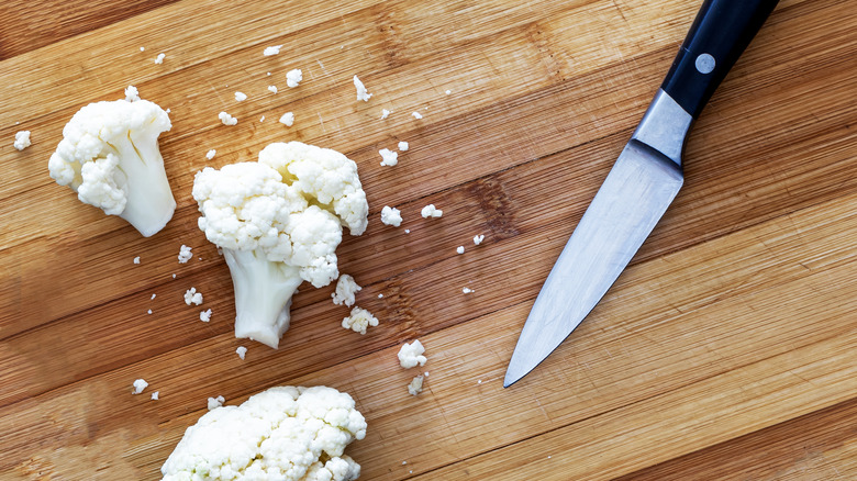 knife cauliflower florets chopping board