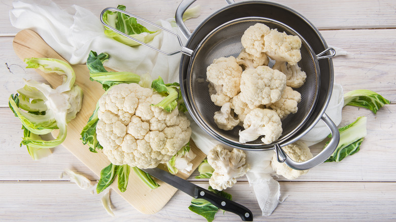 cauliflower in pan and on board