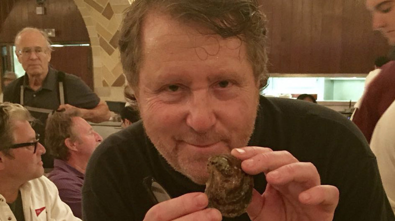 David Rosengarten holding oyster