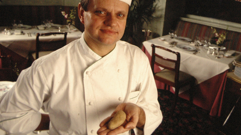 Joël Robuchon holding a potato