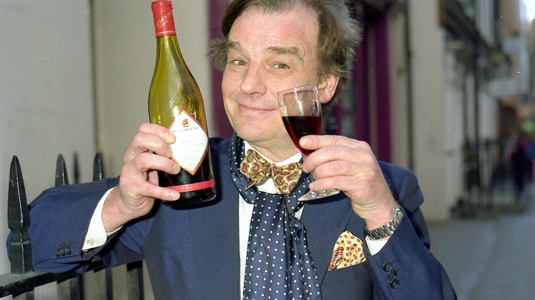 Keith Floyd posing with wine