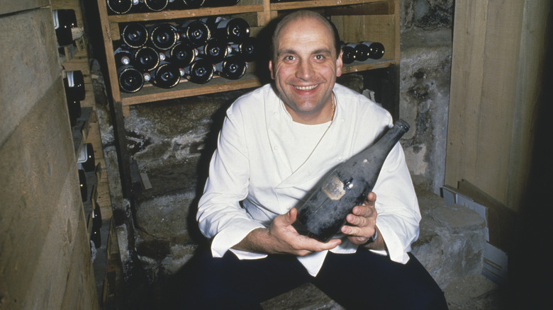 Bernard Loiseau with wine bottle