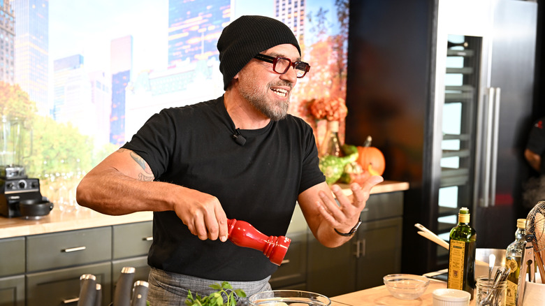 Michael Symon cooking on stage