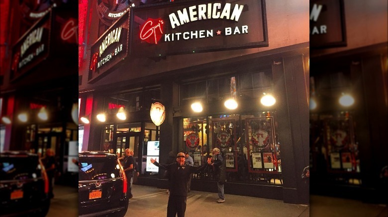 guy fieri in front of Guy's american kitchen & bar