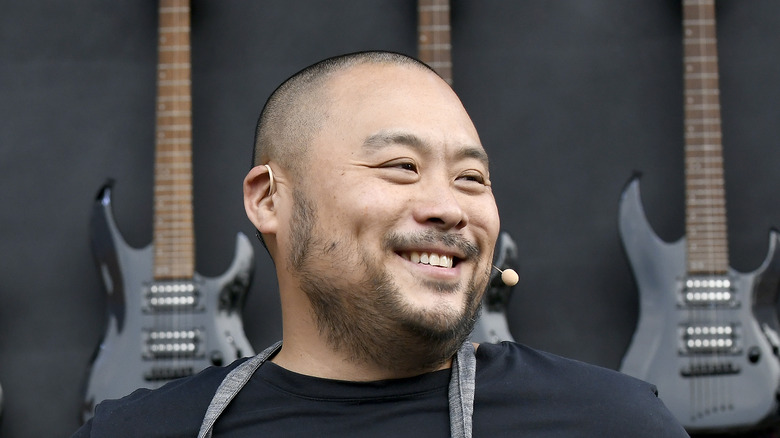 David Chang with electric guitars background