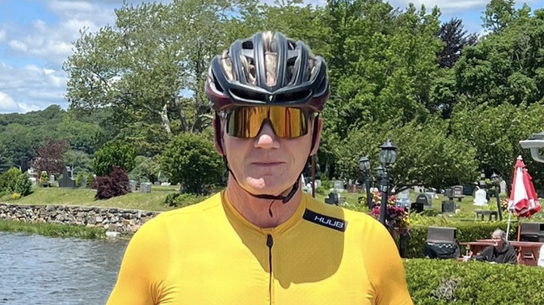 Gordon Ramsay wearing a cycling outfit and helmet