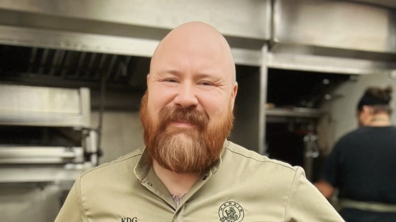 Chef Kevin Gillespie smiles at camera