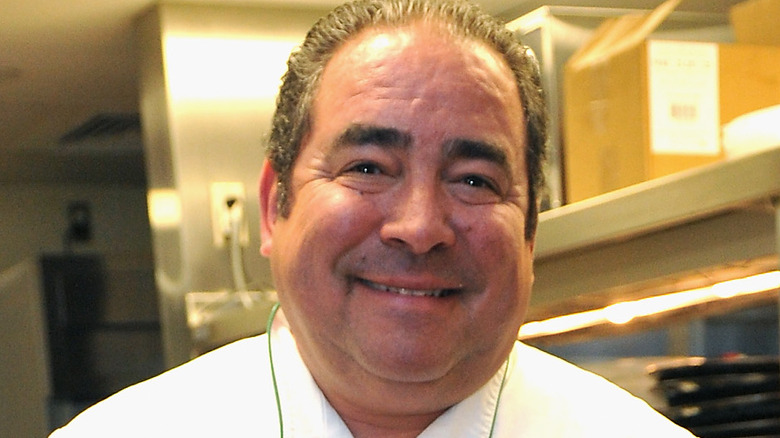 Emeril Lagasse smiling in kitchen