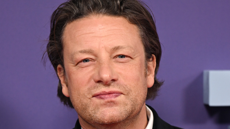 Jamie Oliver with purple background