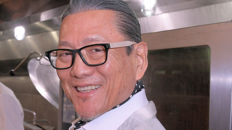 Masaharu Morimoto smiling in kitchen