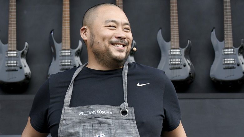 David Chang posing with electric guitars