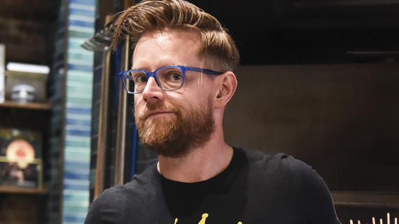 Richard Blais wearing blue glasses