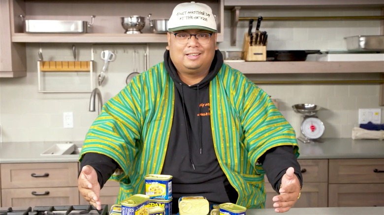 Harold Villarosa with cans of Spam