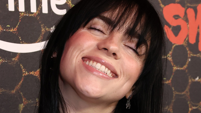 Billie Eilish smiling on the red carpet