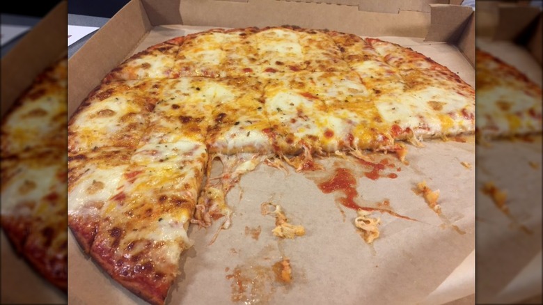 Donatos cheese pizza half eaten