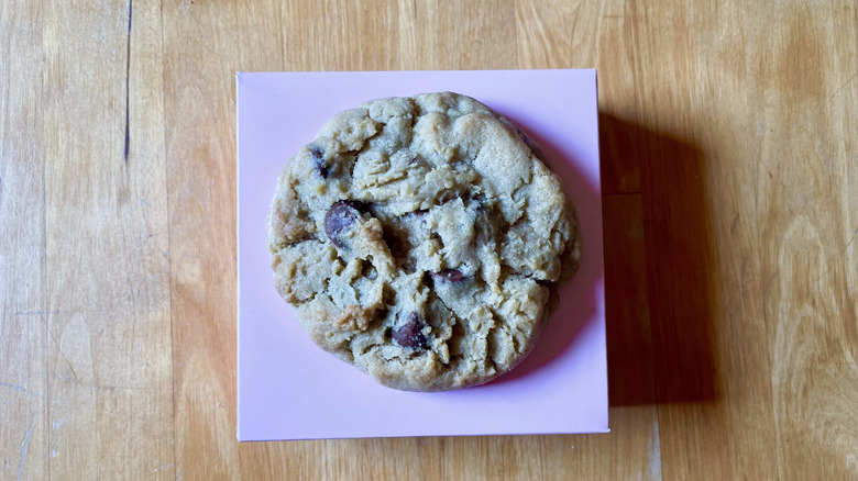 Crumble chocolate chip cookie on pink box