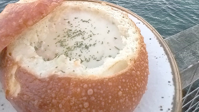 Clam chowder bowl by water