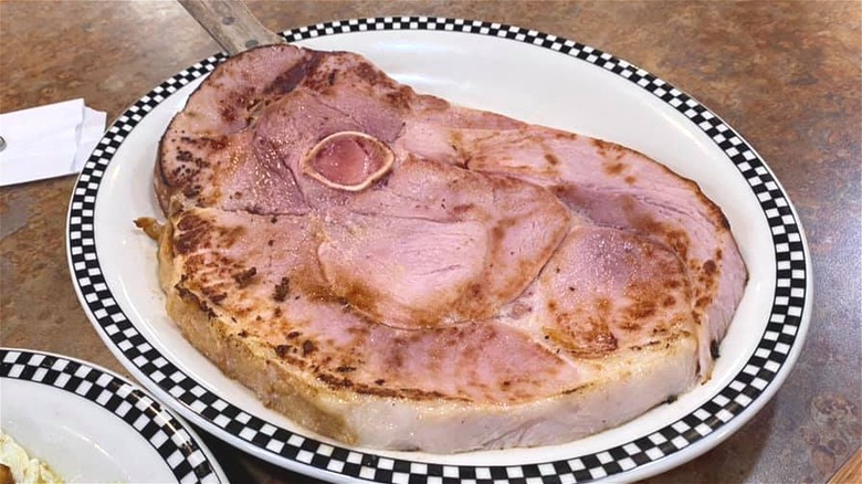 Ham steak on diner plate