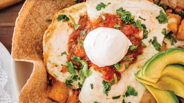 huevos rancheros in large tortilla