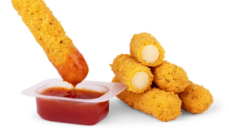 Mozzarella sticks with dipping sauce cup