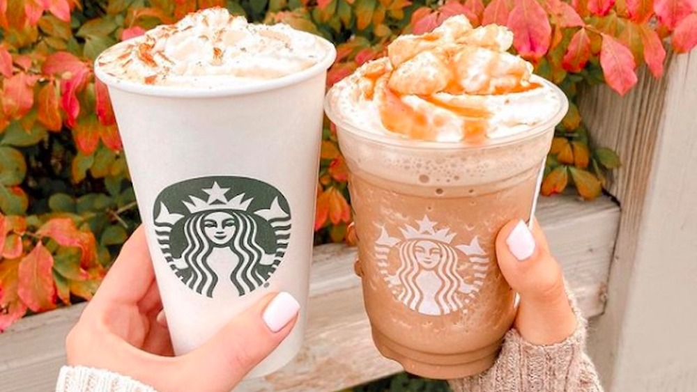 Starbucks Pumpkin Spice Lattes with fall leaves