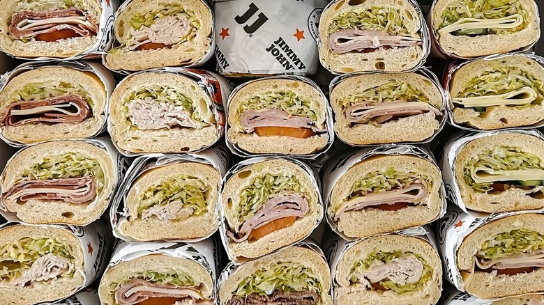 Box of wrapped Jimmy John's sandwich portions neatly organized into rows