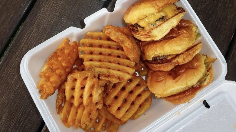 Smalls Sliders and fries in a styrofoam container