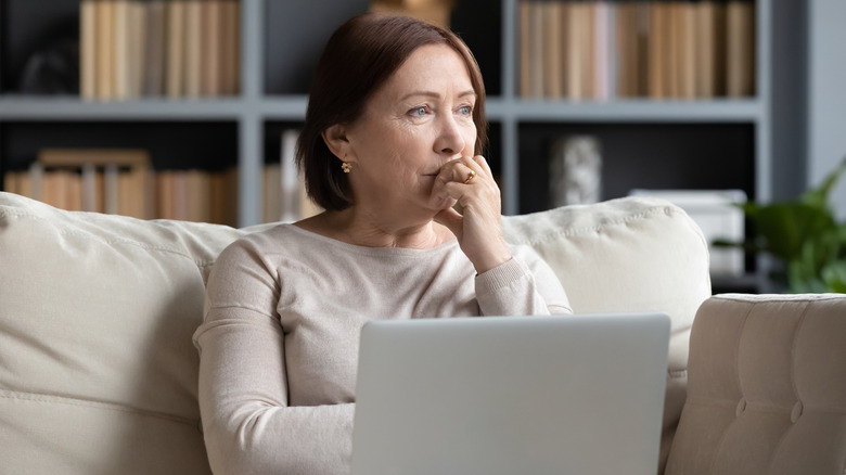 Person sad on computer