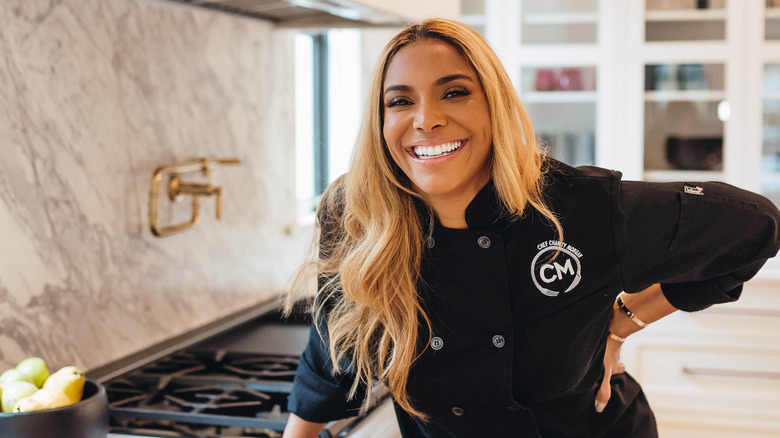 Charity Morgan smiling in the kitchen