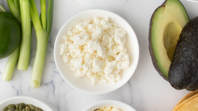 Cotija cheese in white bowl