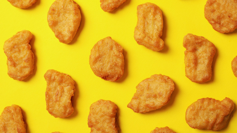 chicken nuggets on yellow background