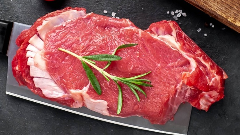 Raw steak with rosemary