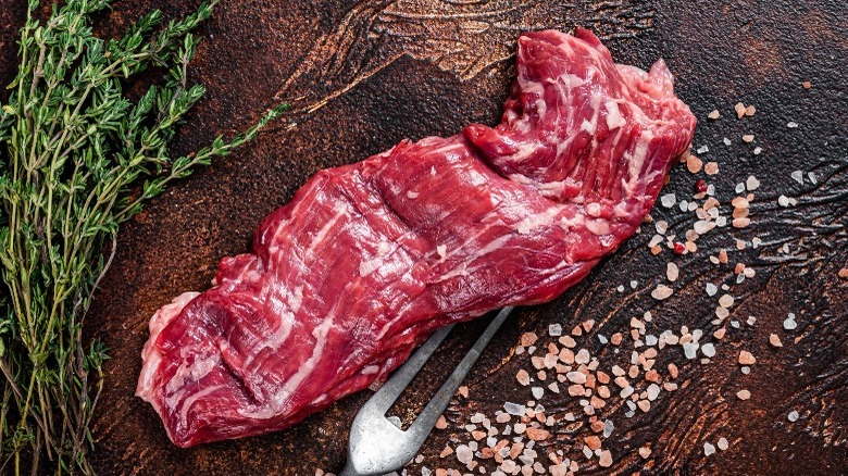 Raw skirt steak, thyme and salt