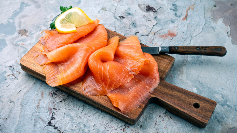 smoked salmon on wooden platter