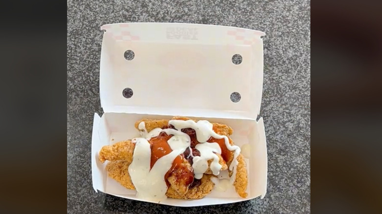 Chicken tenders covered in sauces