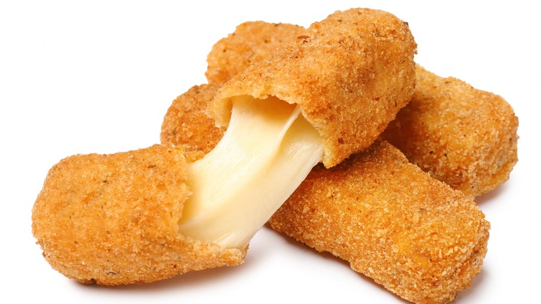 Three fried mozzarella sticks 