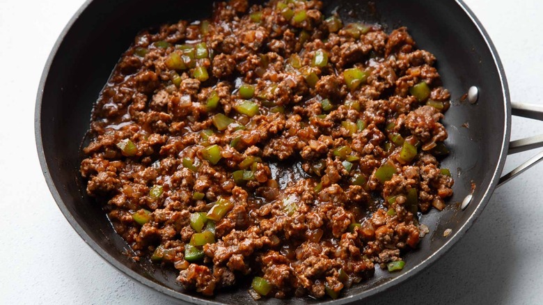 seasoned beef and peppers in a skillet