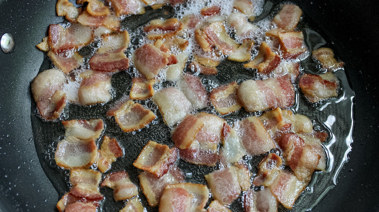 bacon frying in pan