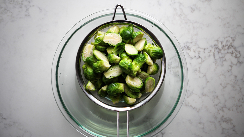 Brussels sprouts in colander