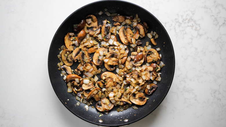 onions and mushrooms in pan